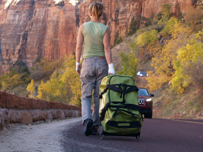 pulling suitcase down the road