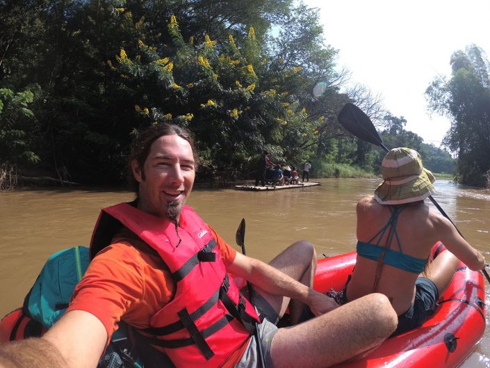 packrafting the mae taeng river with bamboo raft in background